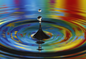 A ripple in the space time continuum droplet of water in rainbow 