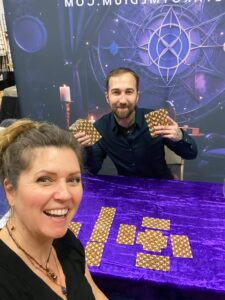 Canadas best tarot reader Chris Bennett giving a client a reading at a psychic fair