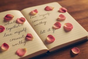 healing-journal-with-flower-petals-self-reflection