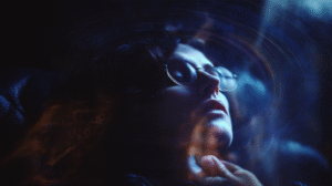 psychic-gifts-what-clairvoyance-clairaudience-looks-like-while-being-experienced-by-an-expert-psychic-medium-female-with-glasses-seeing-the-world-of-spirit