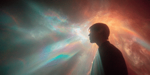 Profile_of_a_person_in_silhouette_standing_with an illuminated spiritual aura showing life after death psychic