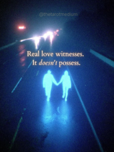 Real love witnesses. It doesn't possess. Two silhouettes facing the water at twilight with a flower between them, symbolizing healthy partnership as witnessing life together, discussed by a psychic medium and tarot reader.