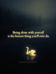 Being alone with yourself is the bravest thing you'll ever do. A single swan surrounded by darkness in a misty lake with a gentle reflection, symbolizing the courage it takes to sit with yourself, explored by Chris Bennett, the best psychic medium and tarot reader.