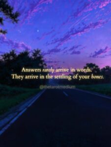 A single shaft of warm light falling on moss in a dark violet forest clearing, with the quote "Answers rarely arrive in words. They arrive in the settling of your bones." From The Tarot Medium on whether deceased loved ones answer back.