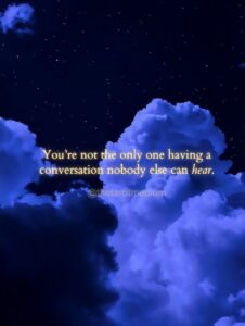A twilight field scattered with dozens of small drifting lights, carrying the quote "You are not the only one having a conversation nobody else can hear." From The Tarot Medium on whether it's normal to talk to a deceased loved one.